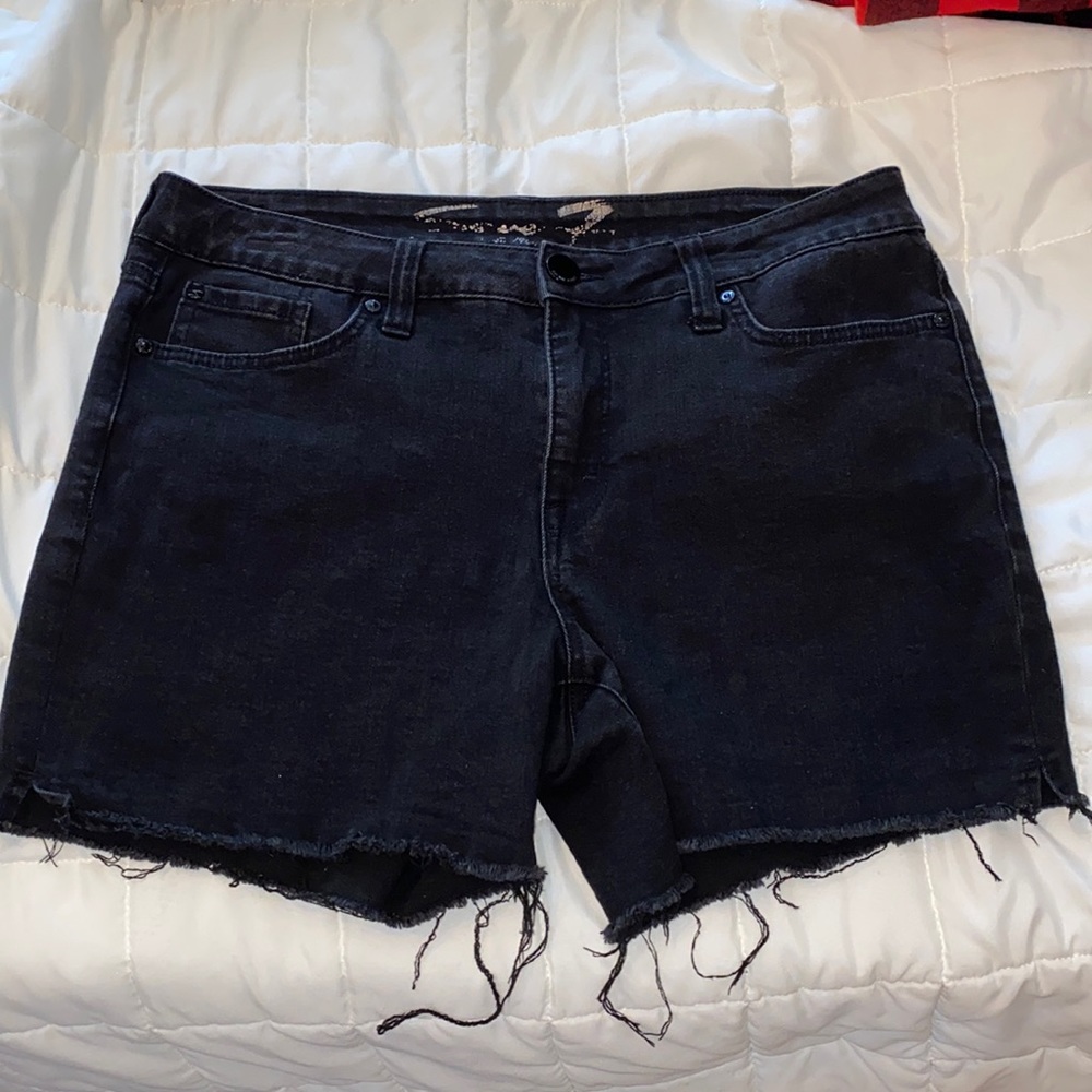 Seven size 10 black weekend cutoffs with stretch.  EUC no stains